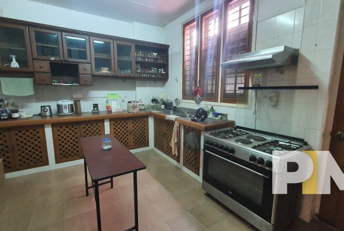 kitchen with electric stove - properties in Yangon