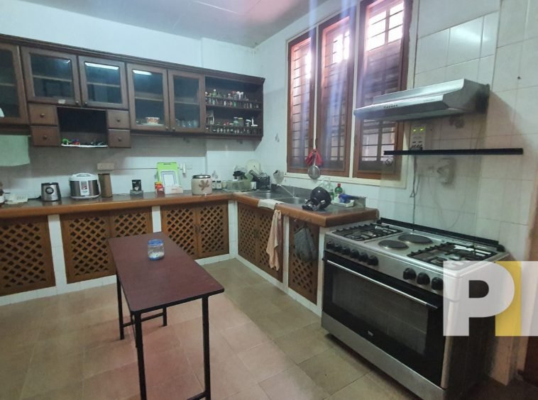 kitchen with electric stove - properties in Yangon