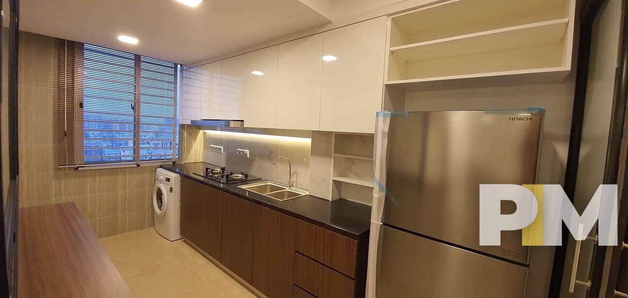 kitchen with fridge - Condo for rent in Mingalar Done