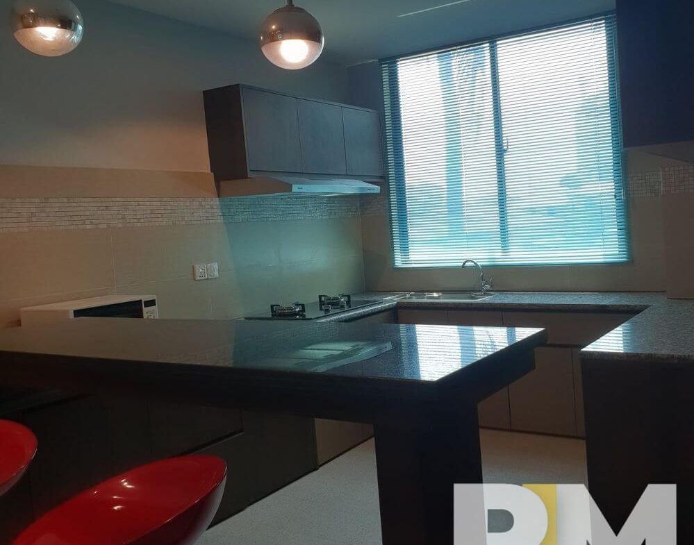 kitchen with hanging light - Condo for rent in Hlaing
