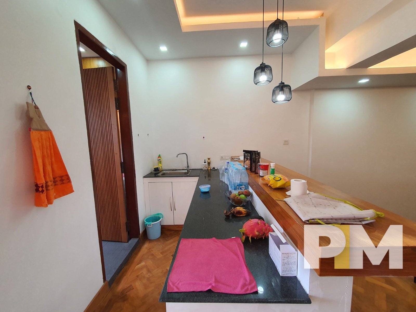 kitchen with hanging light - properties in Yangon