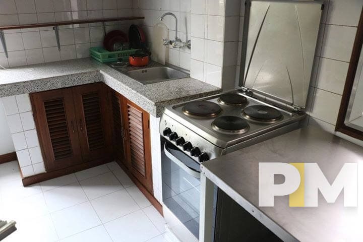 kitchen with stove - property in Yangon