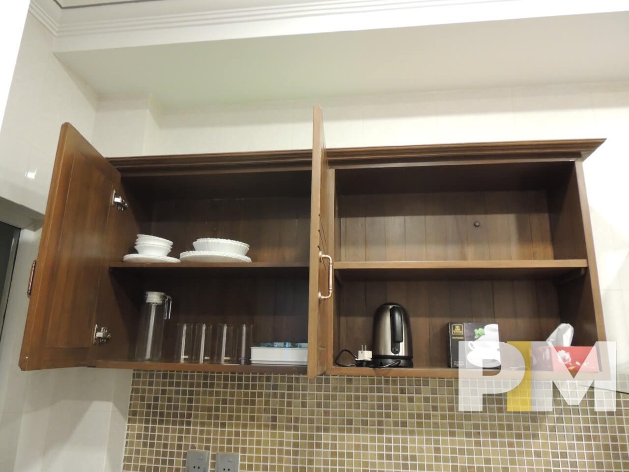 kitchen with wall cabinet - property in Yangon