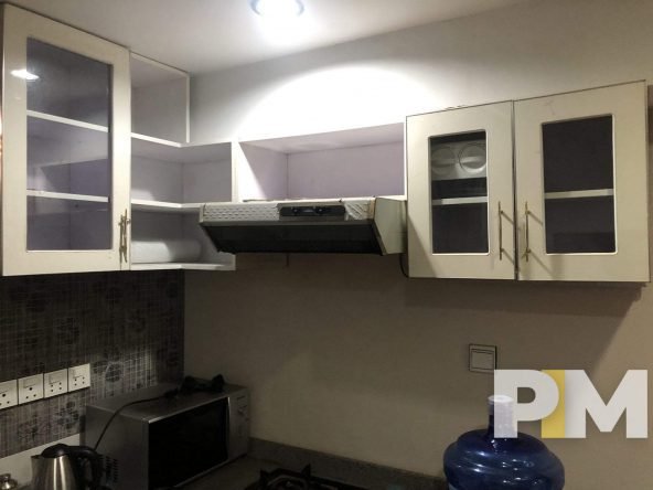 kitchen with wall cabinets - properties in Yangon