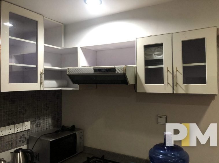 kitchen with wall cabinets - properties in Yangon