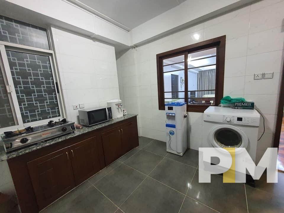 kitchen with washing machine - Rent in Yangon