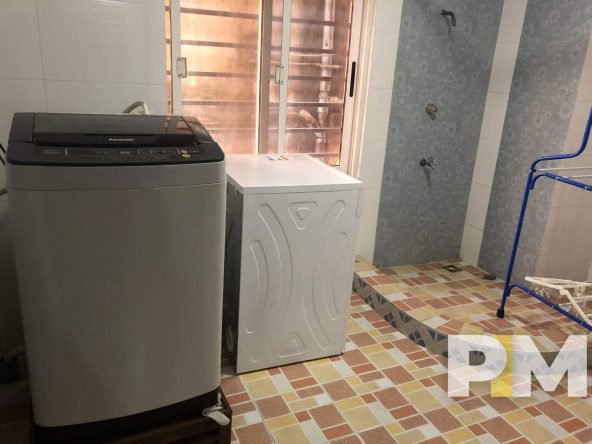 laundry room with washing machine - Real Estate in Yangon