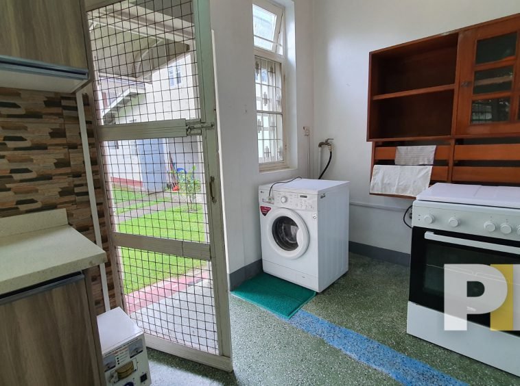 laundry space with washing machine - Yangon Property
