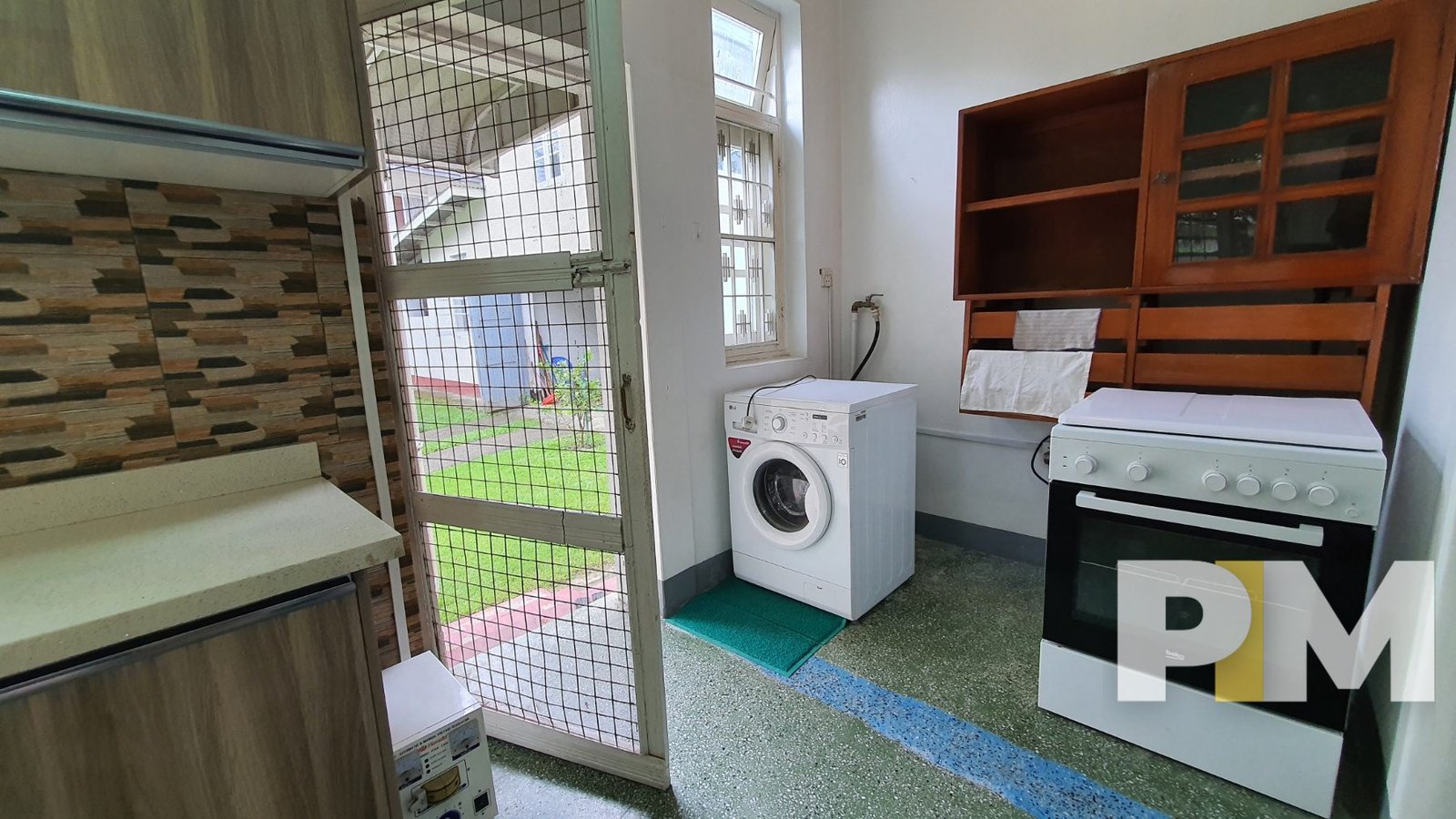 laundry space with washing machine - Yangon Property