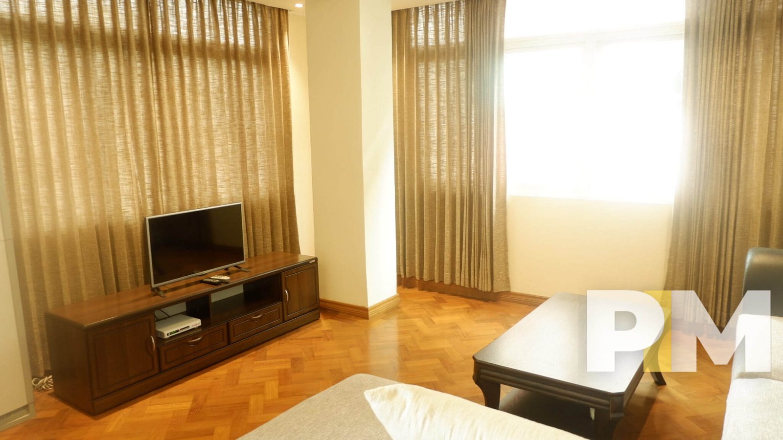 living room with TV - Condo for rent in Kyimyindine