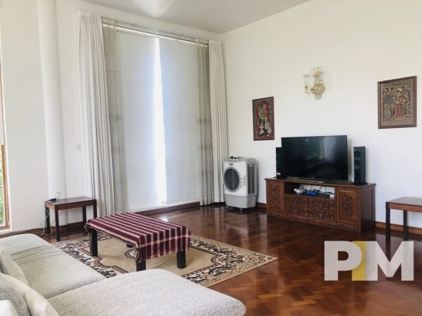 living room with TV - Home Rental Yangon