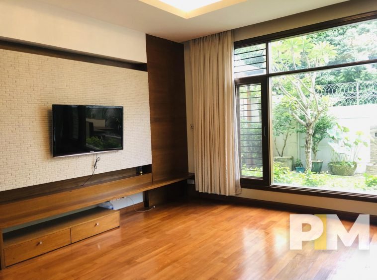 living room with TV - properties in Yangon