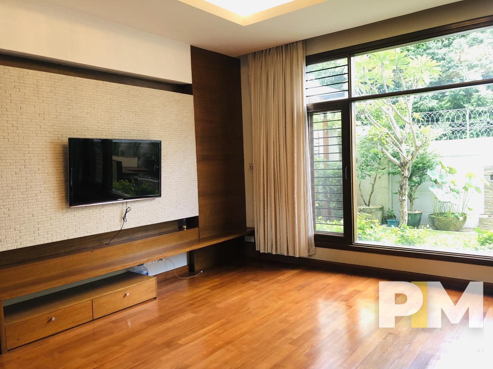 living room with TV - properties in Yangon