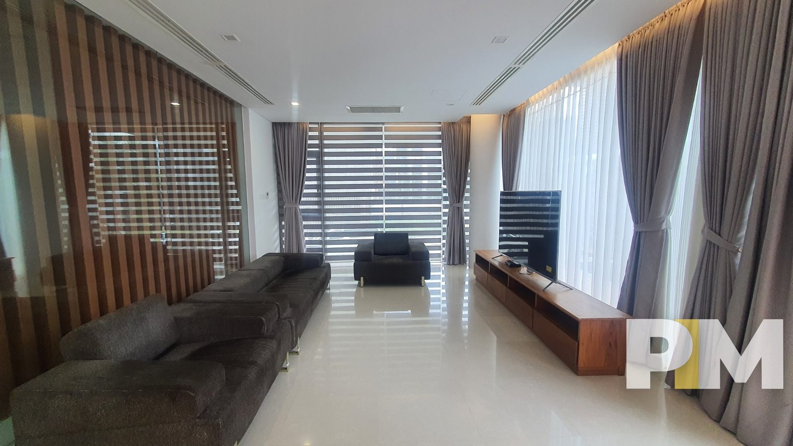 living room with TV - property in Yangon