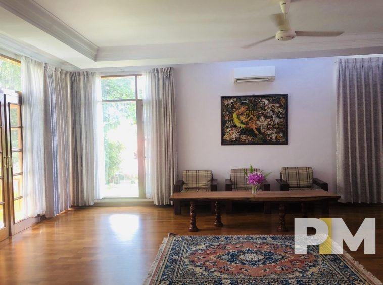 living room with ceiling fan - properties in Yangon