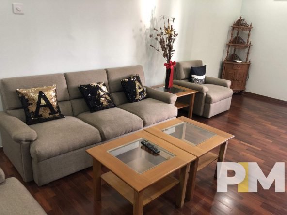 living room with coffee table - property in Yangon