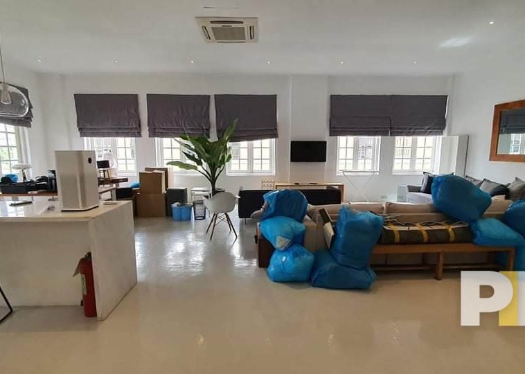 living room with hanging light - Rent in Yangon