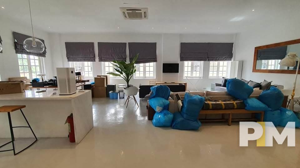 living room with hanging light - Rent in Yangon