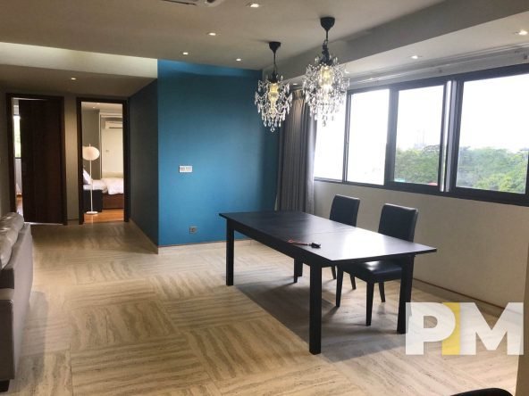 living room with hanging light - properties in Yangon