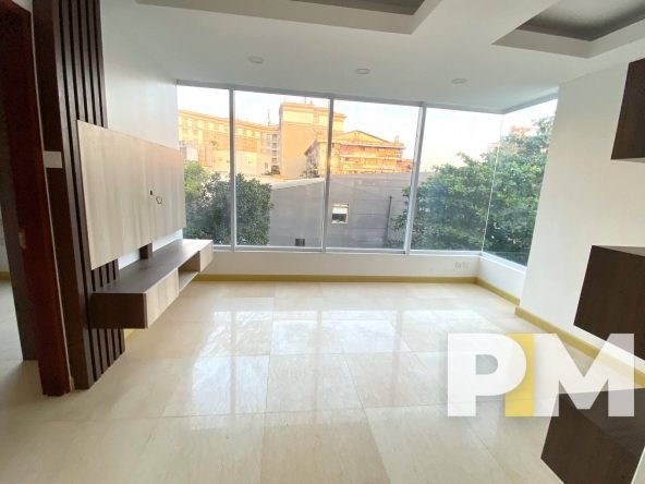 living room with large glass window - Yangon Property