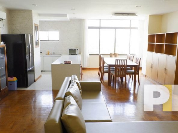 living room with open kitchen - Yanogn Real Estate