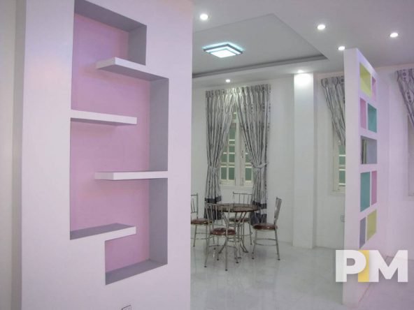 living room with wall shelf - property in Yangon