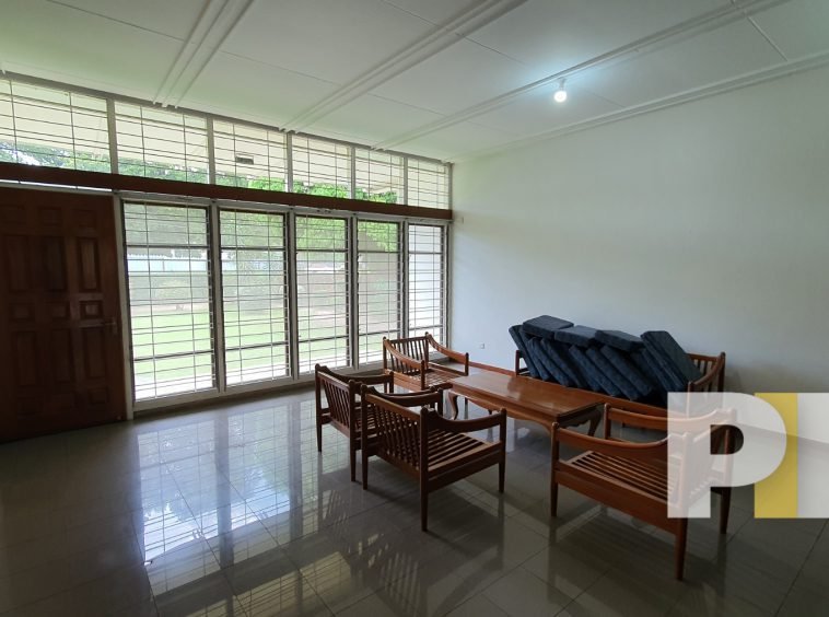 living room with wooden chair set - House for rent in Golden Valley