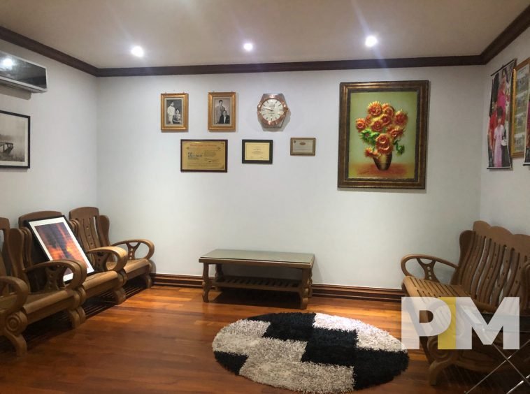 living room with wooden chair set - Yangon Property