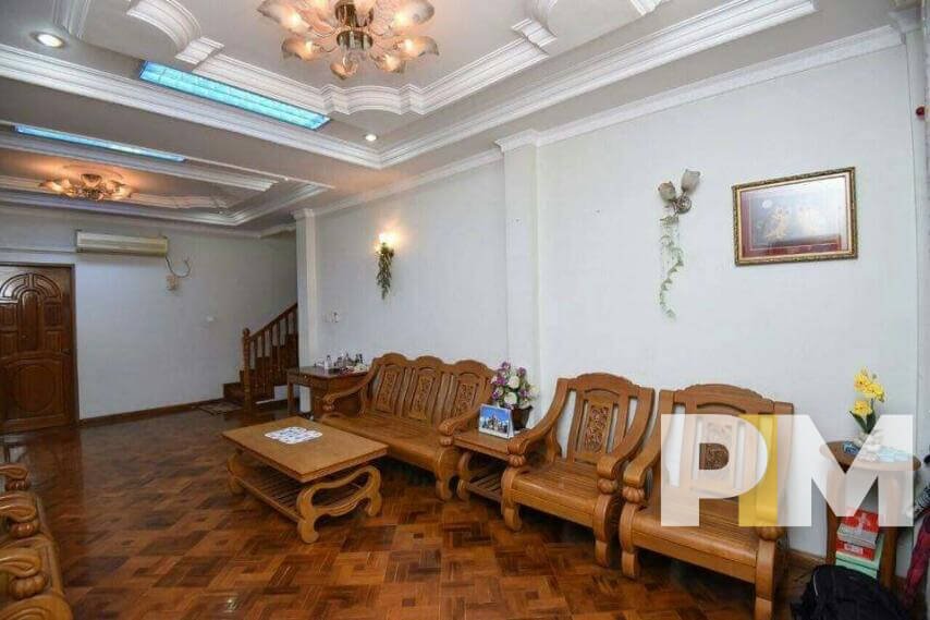 living room with wooden chairs - Rent in Yangon