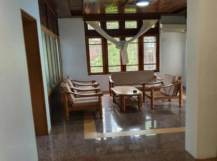 living room with wooden table and chairs - Yangon Property