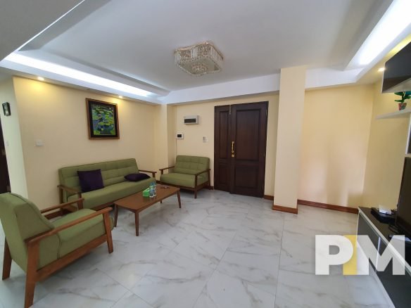 living room with wooden sofa - Real Estate in Yangon