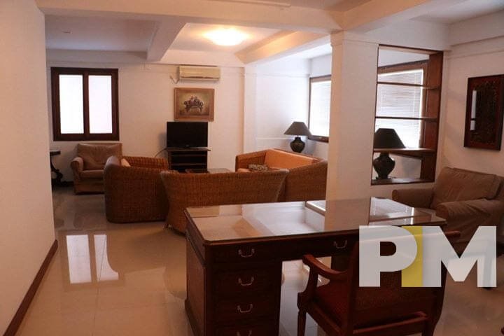 living room with working desk - property in Yangon