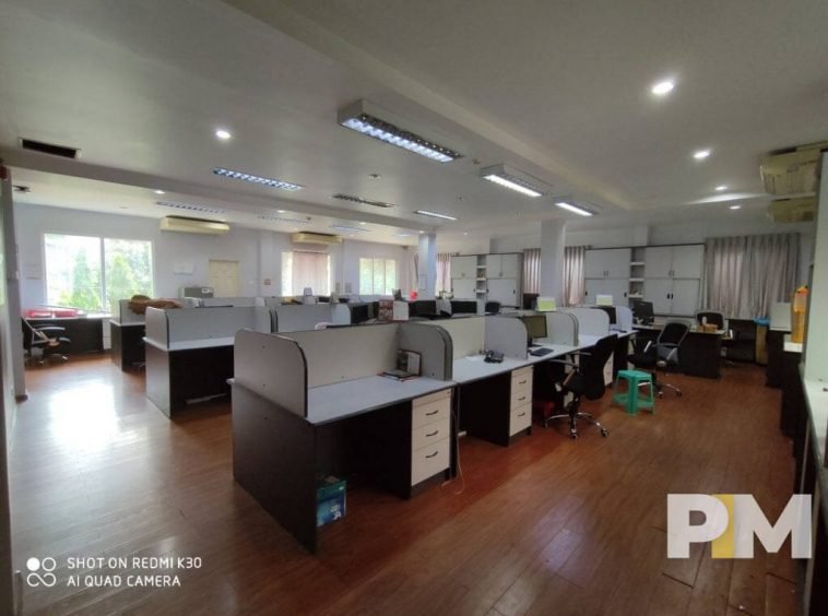 office with working desks and chairs - Real Estate in Yangon