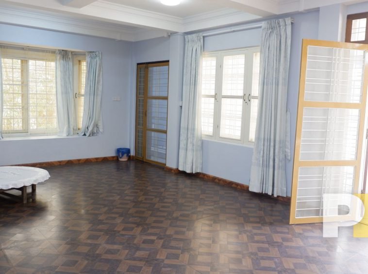 room with a table - Yangon Property