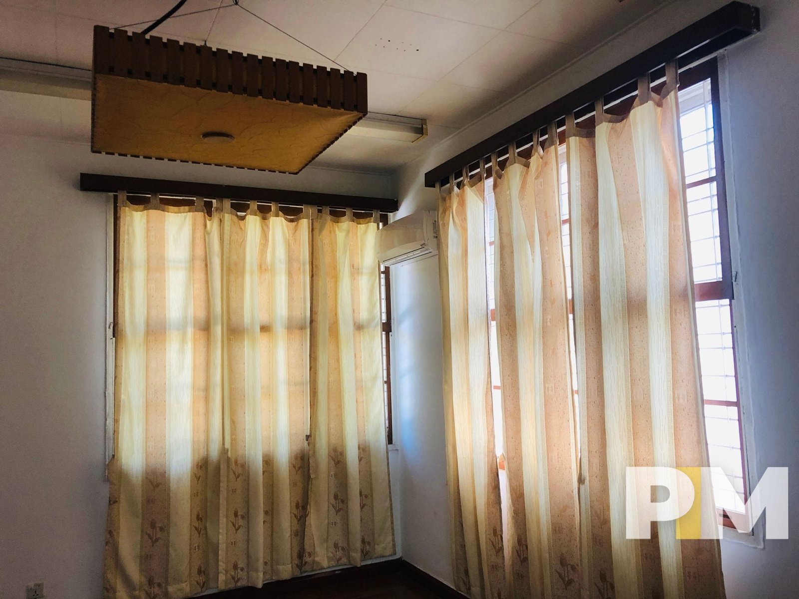 room with hanging lighting square - property in Yangon
