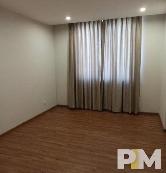 room with long curtains - properties in Yangon