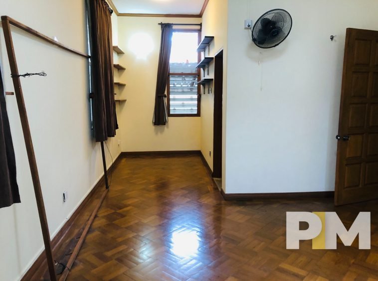 room with wall fan - Myanmar house for rent
