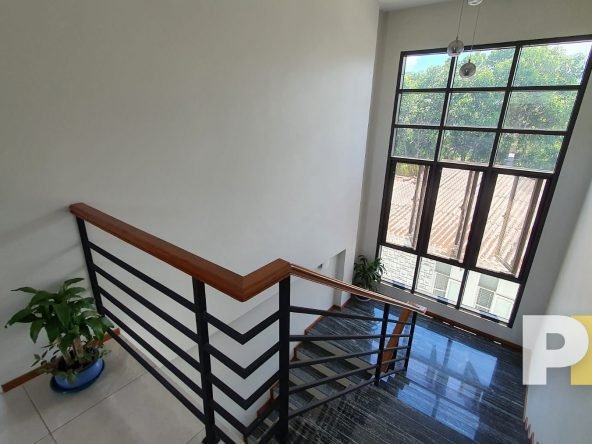 staircase with hanging light - properties in Yangon