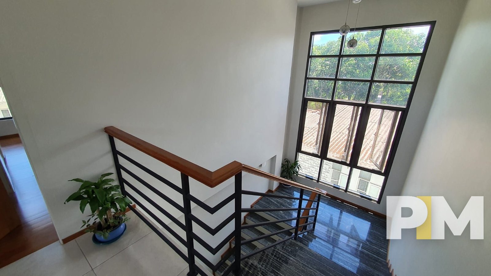staircase with hanging light - properties in Yangon