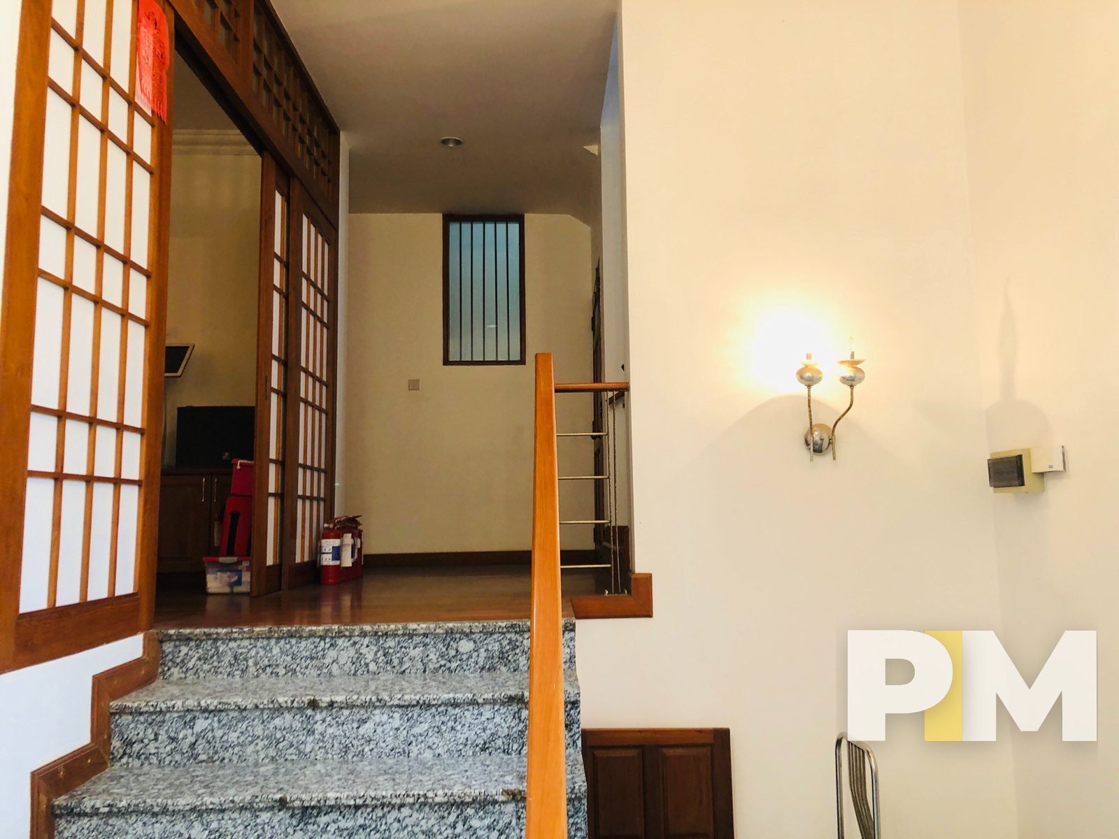 staircase with wall light - properties in Yangon