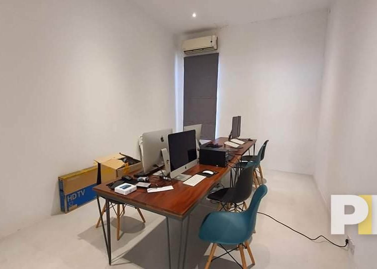 working space with table and chairs - Real Estate in Myanmar