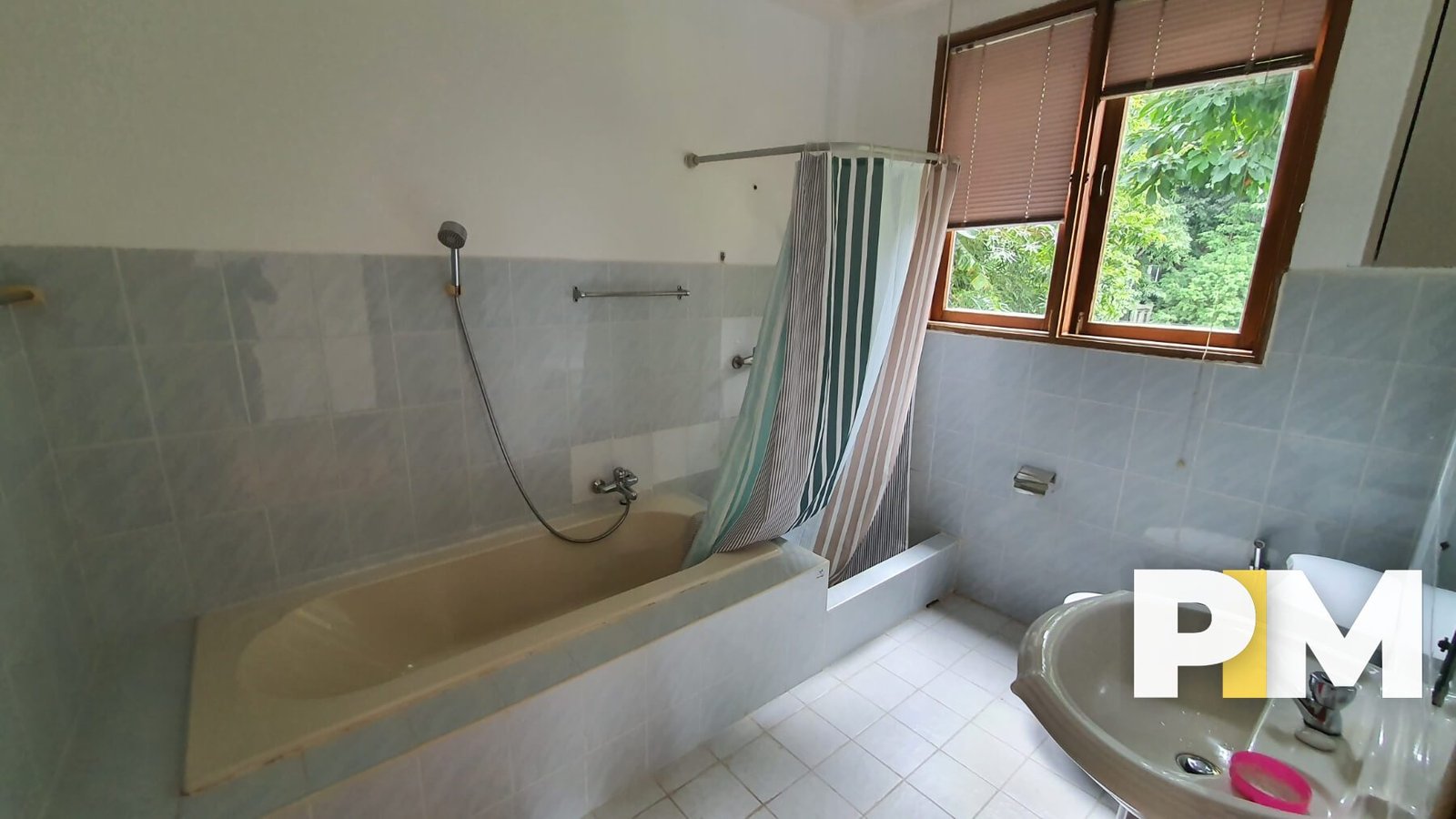Bathroom with bath tub and sink - Property in Myanmar