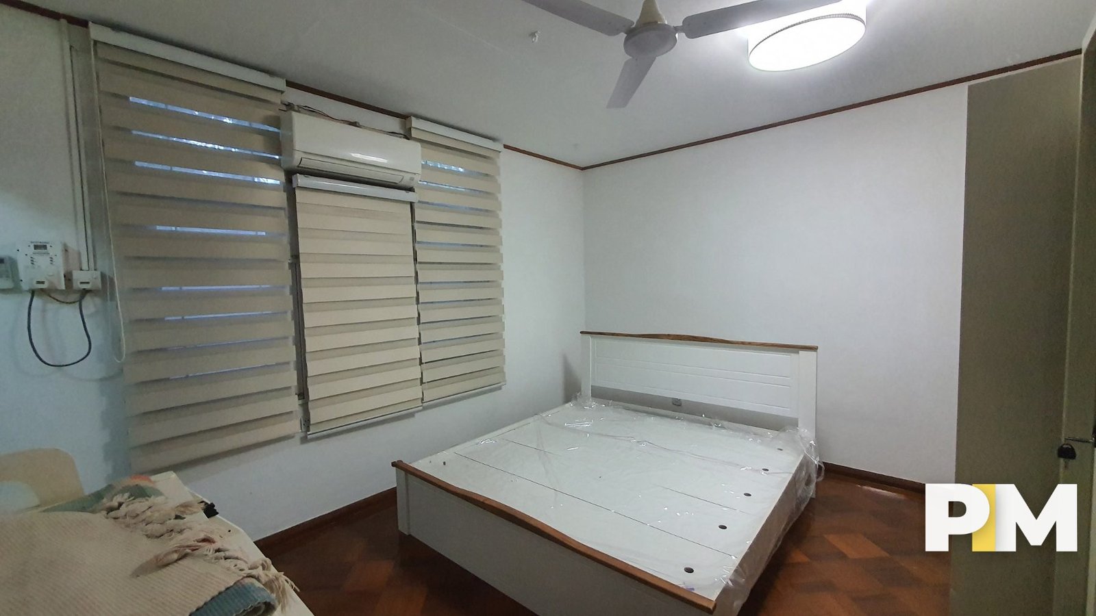 Bedroom with bed and air-conditioner-Myanmar Real Estate