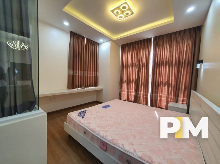 Bedroom with curtaiins - Real Estate in Myanmar