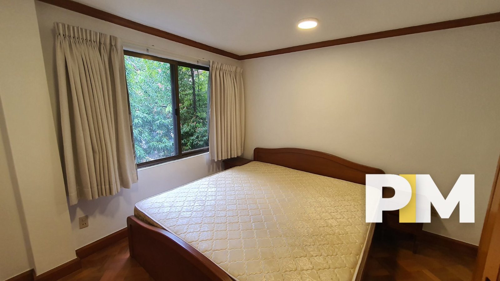 Bedroom with curtains - Property in Myanmar