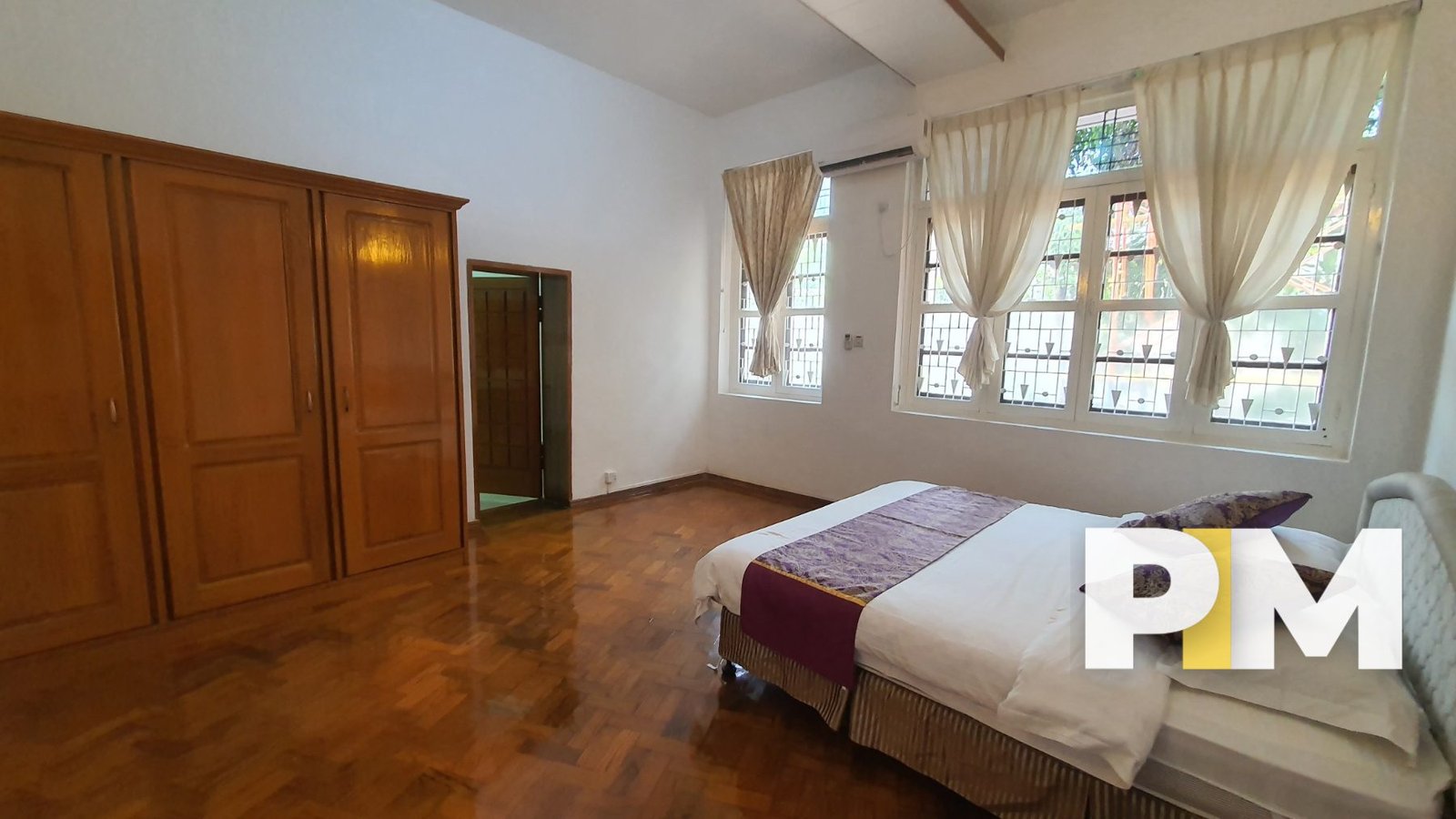 Bedroom with curtains - Property in Yangon