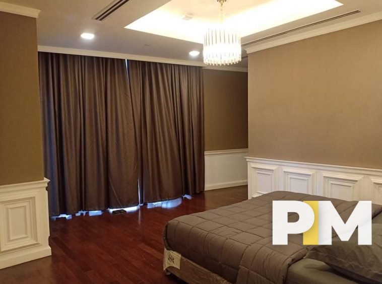 Bedroom with hanging light - Property in Yangon