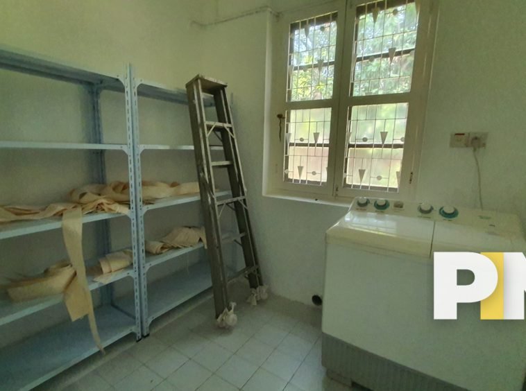 Room with shelf and washing machine - Property in Myanmar