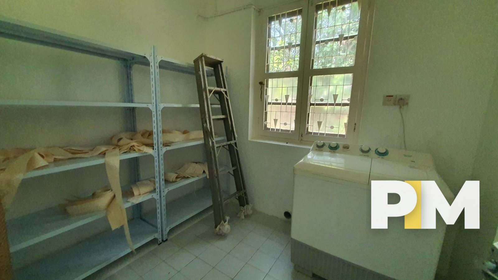 Room with shelf and washing machine - Property in Myanmar