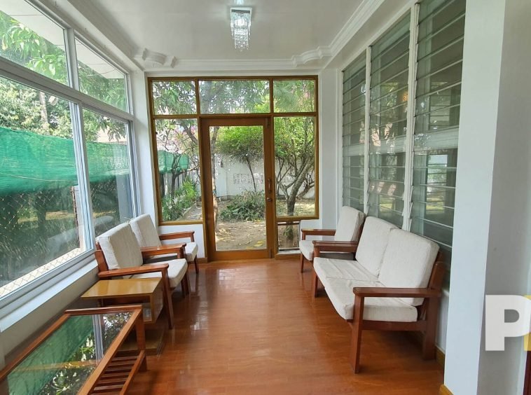 living room with wooden sofa - Rent in Yangon